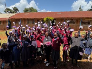 Beatrice delivers supplies to Gatwe Primary School